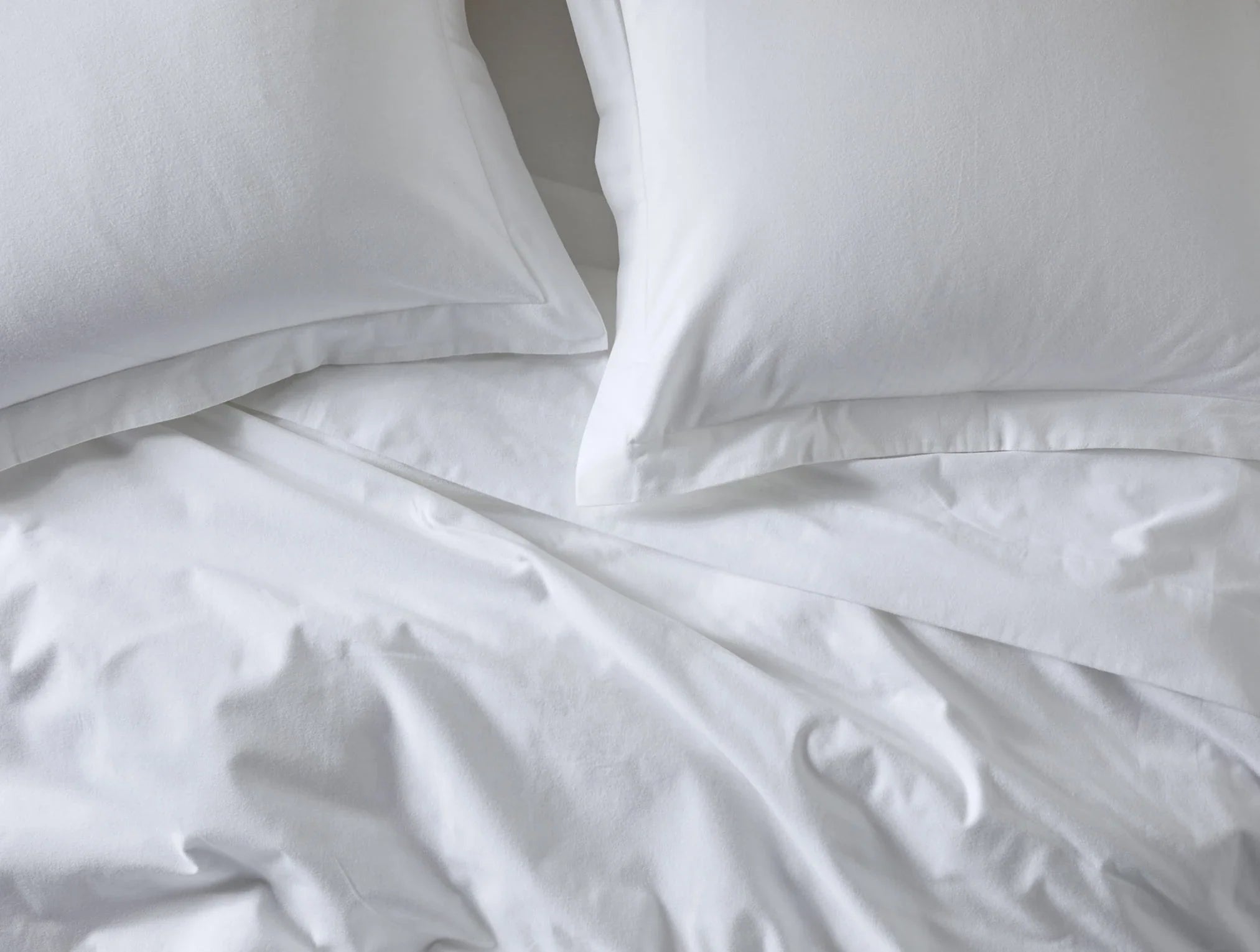 pdp_cloud_brushed_organic_flannel_duvet_shams_alpine_white_overhead_f18_3c9b330f-e65c-4996-9e8b-3effb57a2026